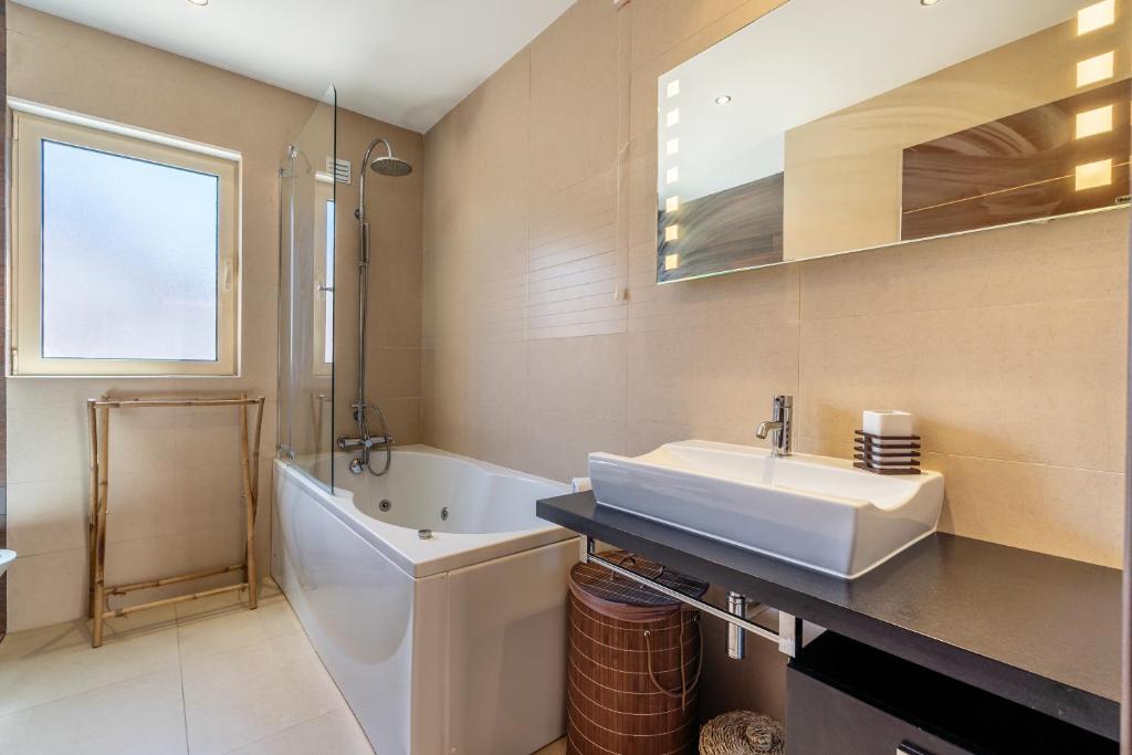 Modern bathroom with bathtub and shower