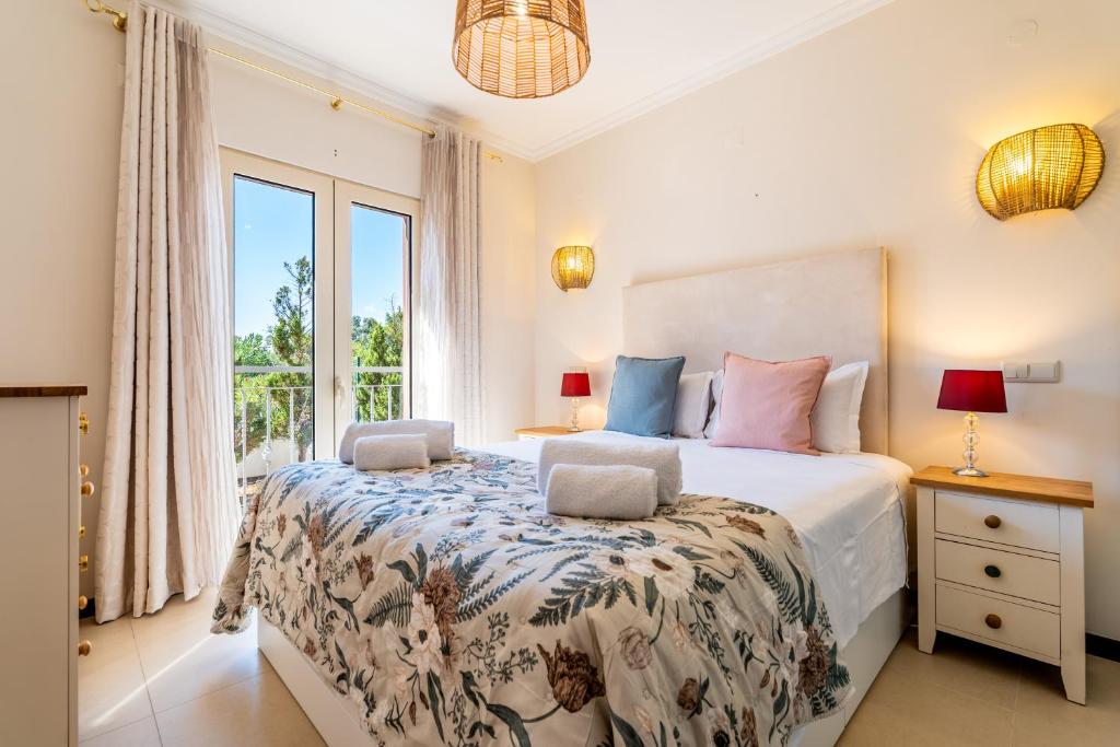 Spacious master bedroom with garden views