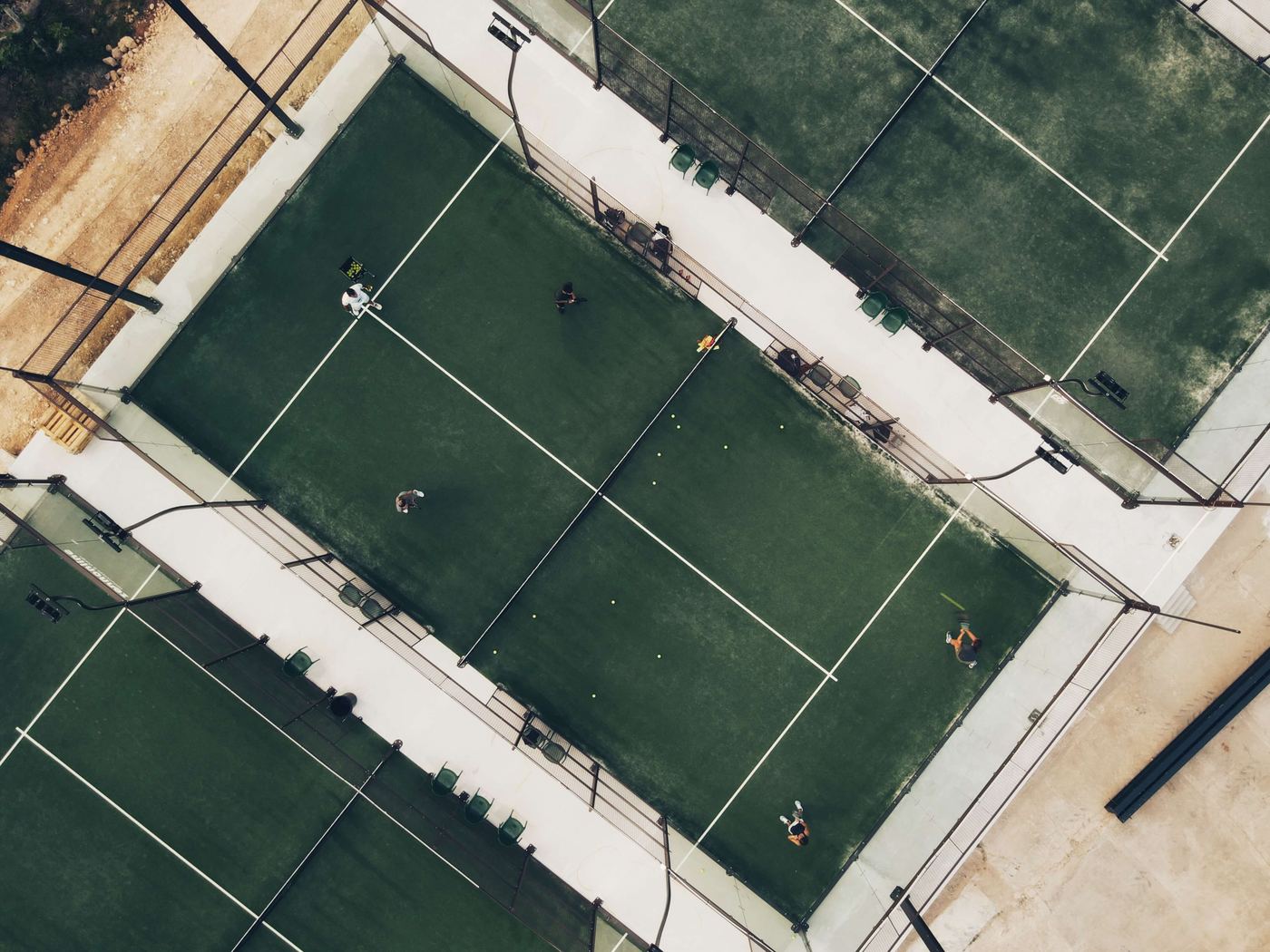 Aerial view of players on the outdoor padel courts at Lagoa Station padel club in Lagoa, Algarve